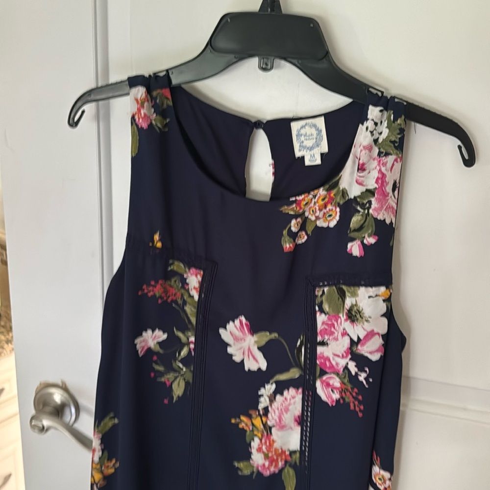 Gently worn sleeveless floral and navy dress